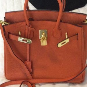Orange leather handbag